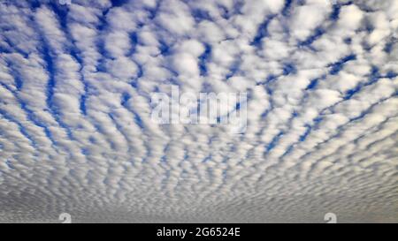 Bright Altocumulus clouds and blue sky in the morning Stock Photo