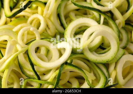 A Background of Plain Zucchini Noodles an Alternative to Grain Pastas Stock Photo