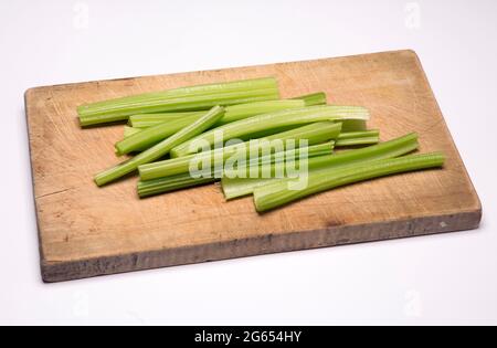 Celery sticks on a chopping board Stock Photo