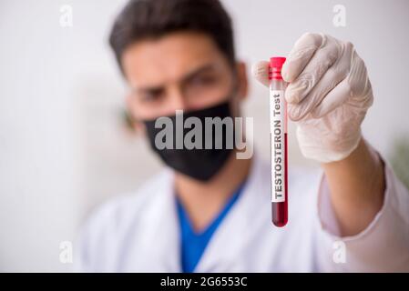 Young biochemist testing blood samples Stock Photo