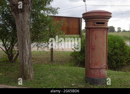 Old mailbox next to a tree. Stock Photo