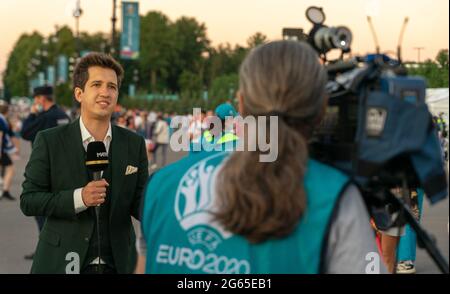 Russia football Match TV channel reporter, after-match reportage, UEFA 2020 quarterfinal game Switzerland-Spain, July 2, 2021. St. Petersburg, Russia Stock Photo