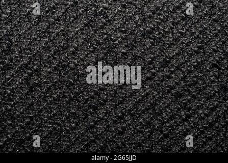 Cloth. The background is made of dark colored fabric. A texture or pattern from a material. A piece of fabric for the work of a designer, fashion desi Stock Photo