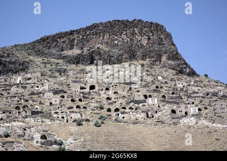 the old greek abandoned village of Gore in Turkey the ruined houses under a volcanic rocky cliff of central Anatolia Stock Photo