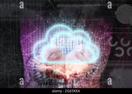 persons hand hold glowing cloud, data information digital storage concept Stock Photo