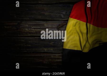 cute any holiday flag 3d illustration  - dark photo of Belgium flag with big folds on old wood with free place for your content Stock Photo