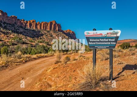 Road sign at Wolverine Petrified Wood Natural Environmental Area, Circle Cliffs on left, Grand Staircase-Escalante National Monument, Utah, USA Stock Photo