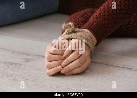 Female Hostage With Tied Hands Lying On Floor In Room Stock Photo Alamy