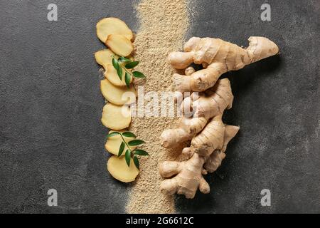 Fresh and ground ginger on dark background Stock Photo