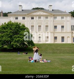 London, Greater London, England - June 26 2021: 2 ladies in hats doing a photo shoot in front of Kenwood House in Hampstead Heath, Hampstead. Stock Photo
