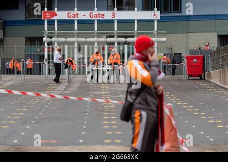Cardiff, Wales, UK. 3rd July, 2021. Stewards outside the Principality Stadium await a limited number of socially distanced fans as the stadium reopens to fans for the first time since February 2020. No food or drink will be served inside the ground during the match between Wales and Canada and alcohol is banned. Credit: Mark Hawkins/Alamy Live News Stock Photo