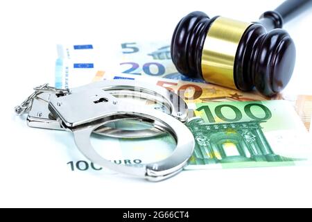 Metal handcuffs and mobile phone on chart graph background. Hacker economy finance banking static concept. Stock Photo