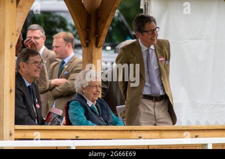 Windsor, Berkshire, UK. 3rd July, 2022. Queen Elizabeth II was enjoying Royal Windsor Horse Show this morning. Her horse First Receiver, came first in the RoR Open in Hand Show Series Qualifier for former race horses. Her Senior Groom Terry Pendry and her Racing Manager Sir John Warren watched the Qualifier with Her Majesty the Queen. Credit: Maureen McLean/Alamy Stock Photo