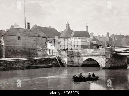 A late 19th century view of the River Stour and the 14th century Barbican gateway built in the late 14th century and later occupied by the toll collector for the Sandwich Toll Bridge, in Sandwich, Kent, England. Sandwich was one of the Cinque Ports and also gave its name to the food by way of John Montagu, 4th Earl of Sandwich, and the word sandwich is now found in several languages.