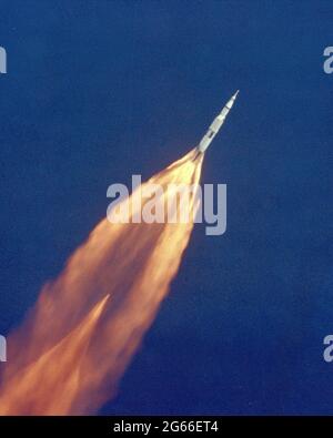 The Apollo 11 Saturn V space vehicle climbs toward orbit after liftoff from Pad 39A at 9:32 a.m. EDT. In 2 1/2 minutes of powered flight, the S-IC booster lifts the vehicle to an altitude of about 39 miles some 55 miles downrange. This photo was taken with a 70mm telescopic camera mounted in an Air Force EC-135N plane. Onboard are astronauts Neil A. Armstrong, Michael Collins and Edwin E. Aldrin, Jr. Stock Photo