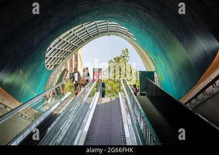 Eindhoven, The Netherlands Juny 2nd 2021. Bicycle parking in the centre of the city with people going down the escalator to park their bike on a sunny Stock Photo