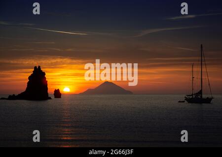 Sunset over the mediteranean sea with the shadow of Filicudi volcano Stock Photo