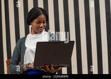 overexcited african lady in the office Stock Photo