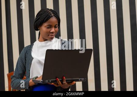 overexcited african lady in the office Stock Photo
