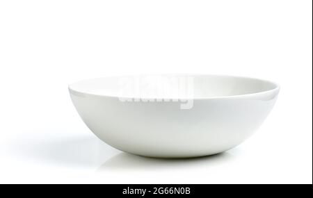 Empty white ceramic bowl isolated on white background Stock Photo