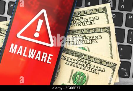 Cyber crime concept photo, mobile phone with malware and money on the laptop, hacker anoymous attack Stock Photo