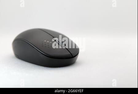 Close up of a black mouse on a white background, copy space Stock Photo