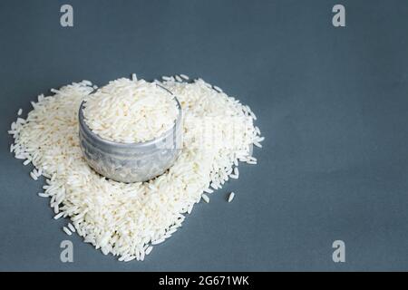 Thai sticky rice in a silver container on a gray background. Copy space. Stock Photo