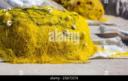 Fishing net with cork floats on wire mesh closeup as decorative