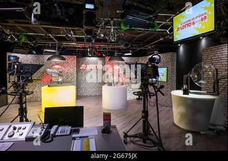 03 July 2021, Saarland, Saarbrücken: The drawing machines for the lottery numbers 6 out of 49 (l) and the super number are located in the new studio backdrop. The draw is broadcast live from a Saarländischer Rundfunk studio on the Internet at lotto.de. Photo: Oliver Dietze/dpa Stock Photo