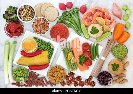 Low glycemic food for diabetics for a healthy diet with vegetables, seafood, grains, dairy, nuts, pasta and dips. Below 55 on the GI scale. Stock Photo