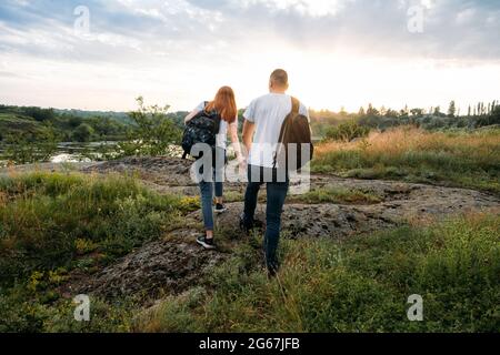 Adventure, Hiking, Trekking, Bushcraft Concept. Solo family travel. Local  travel. Young happy couple travelers hiking with backpacks on rocky trail  on Stock Photo - Alamy