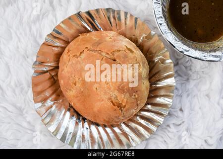 Delicious popular Indian teatime snack or breakfast dish item Dal Kachori deep fried. top view Kachodi snacks serve with khajur chutney Stock Photo