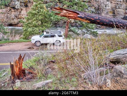 Fort Collins, CO, USA - May 11, 2021: Toyota 4Runner SUV (2016 Trail model) in the Poudre River Canyon in Colorado Rocky Mountains, springtime scenery