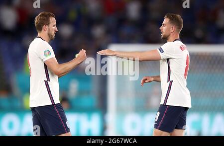 England's Harry Kane gives the captain's armband to Jordan Henderson after being substituted during the UEFA Euro 2020 Quarter Final match at the Stadio Olimpico, Rome. Picture date: Saturday July 3, 2021. Stock Photo