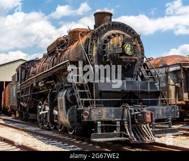 An old steam locomotive railroad train engine shows its age Stock Photo
