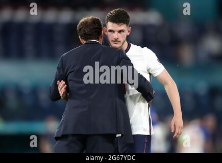 England manager Gareth Southgate embraces Declan Rice after the UEFA Euro 2020 Quarter Final match at the Stadio Olimpico, Rome. Picture date: Saturday July 3, 2021. Stock Photo