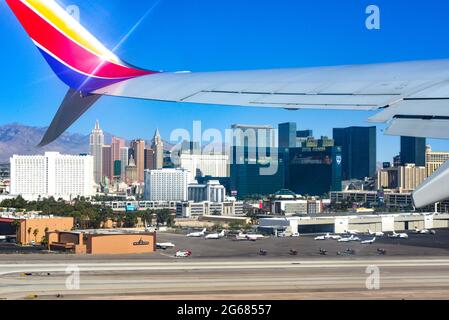 View from the cabin window of a 780 Max Southwest Airlines jet just after lift off, with a view of the casinos lining the Strip at the Las Vegas MaCar Stock Photo