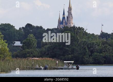 Lake Buena Vista, USA. 15th June, 2016. In the shadow of the Magic Kingdom, Florida Fish and Wildlife Conservation Officers search for a young boy June 15, 2016 after the boy was grabbed Tuesday night by an alligator at Grand Floridian Resort at Disney World near Lake Buena Vista, Fla. Since the incident, around 250 alligators have been removed from Disney properties. (Photo by Red Huber/Orlando Sentinel/TNS/Sipa USA) Credit: Sipa USA/Alamy Live News Stock Photo