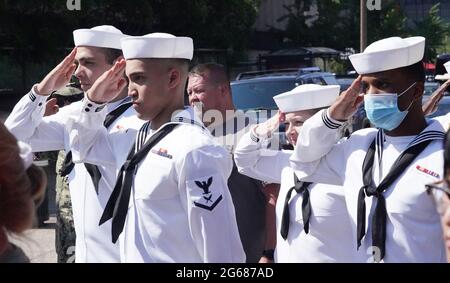 St. Louis, United States. 03rd July, 2021. Navy sailors salute during the playing of the National Anthem before the start of America's Birthday Party Parade in downtown St. Louis on Saturday, July 3, 2021. Photo by Bill Greenblatt/UPI Credit: UPI/Alamy Live News Stock Photo