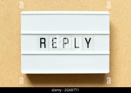 Lightbox with word reply on wood background Stock Photo