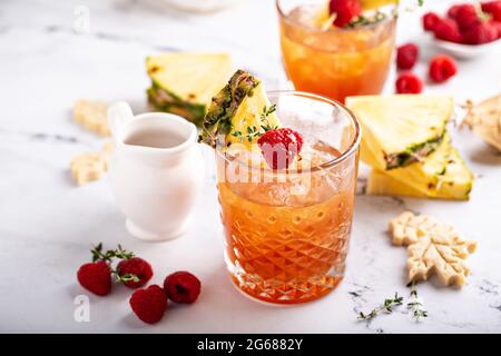Pineapple, raspberry and honey cocktail or mocktail Stock Photo