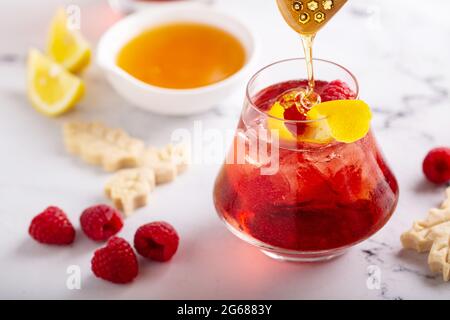 Raspberry, honey and lemon cocktail or mocktail Stock Photo