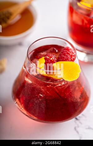 Raspberry, honey and lemon cocktail or mocktail Stock Photo