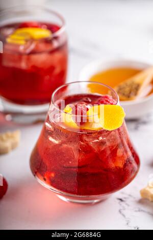 Raspberry, honey and lemon cocktail or mocktail Stock Photo