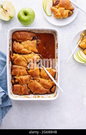 Apple dumplings in flaky pastry with caramel sauce Stock Photo