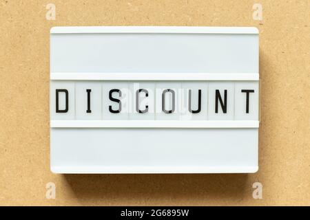 Lightbox with word discount on wood background Stock Photo