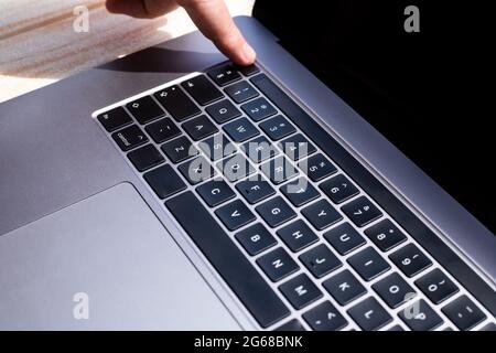 Hands Pointing Pressing Computer Keyboard Keys Typewriting New Ideas. Fingers Tapping Typing Fresh Thoughts Using Wireless Notebook Keypad. Stock Photo