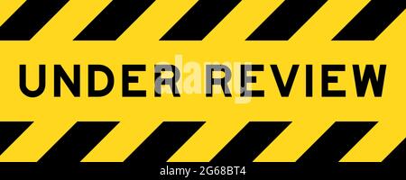 Yellow and black color with line striped label banner with word under review Stock Vector