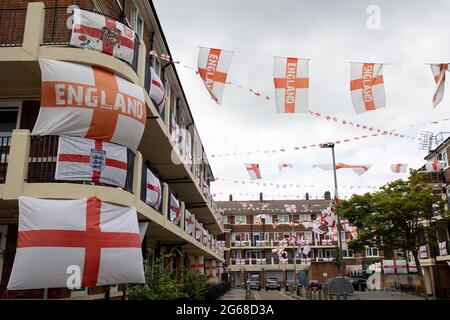 Over 400 St George's flags display in the estate.A football fan, Chris Ralph Dowes, organized the decoration of over 400 St George's flags displayed in the Kirby Estate in South-East London together with other residents ahead of the start of the tournament of UEFA Euro 2020. The tradition of the estate to put up hundreds of St George's flags was since the Euro 2012 and each times the residents managed to fit more flags into the estate. During each game by the England team, Chris will be the host and invite other residents to join watching. He said all the flags would stay until the England tea Stock Photo