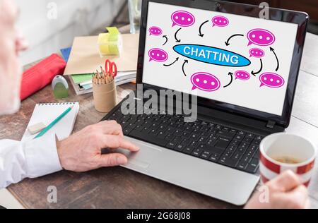 Chatting concept shown on a laptop screen Stock Photo